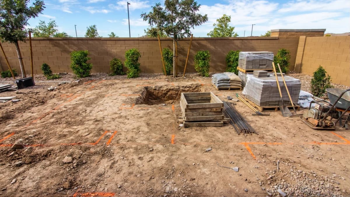 Before: old cracked concrete driveway
